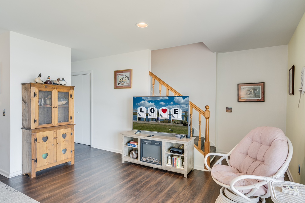 Flat Screen TV and beachy Flooring....