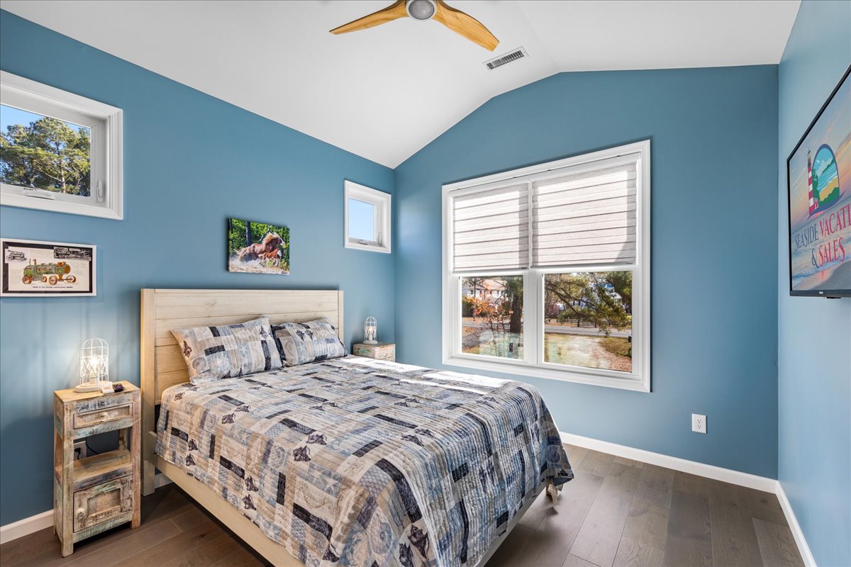 Bedroom 2 also has a comfy Queen Bed and beachy blue walls.