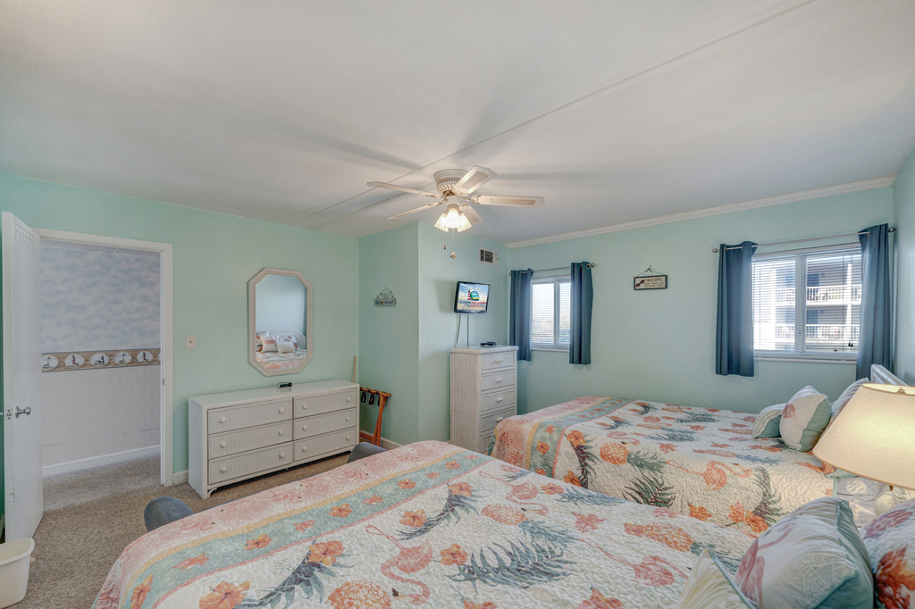 This relaxing Bedroom has a TV for entertainment and plenty of dresser space to unpack and settle in!