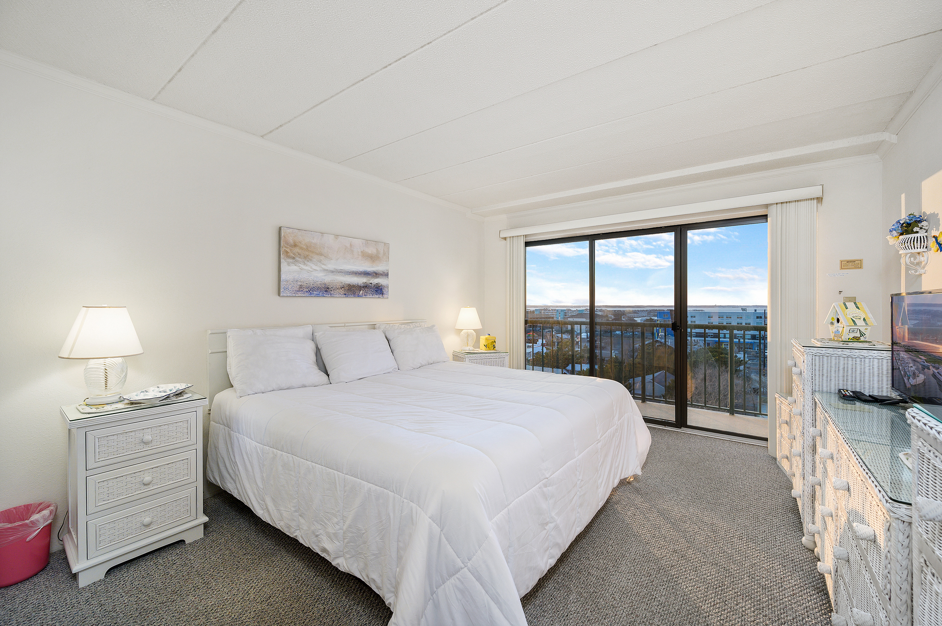 The Bedroom is a serene retreat with a plush King Bed and breathtaking views!