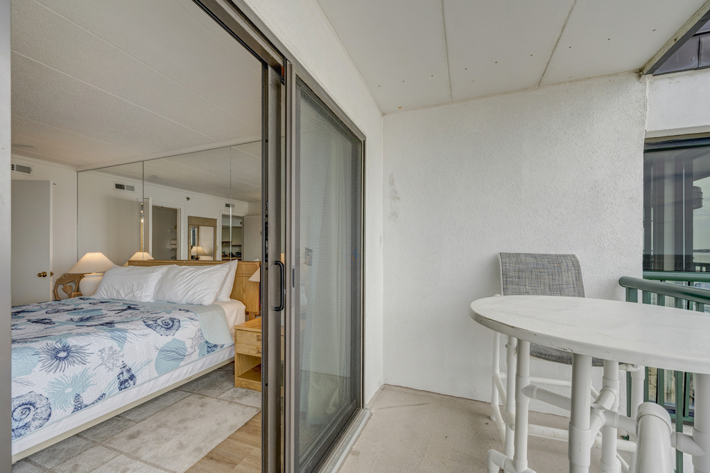 Balcony access from the Primary Bedroom provides you with views of the Beach and the Bay!