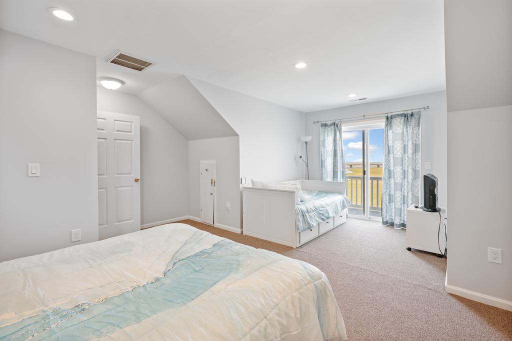 Bedroom 2 sleeps 4 with a Queen Bed and Twin Trundle Bed.
