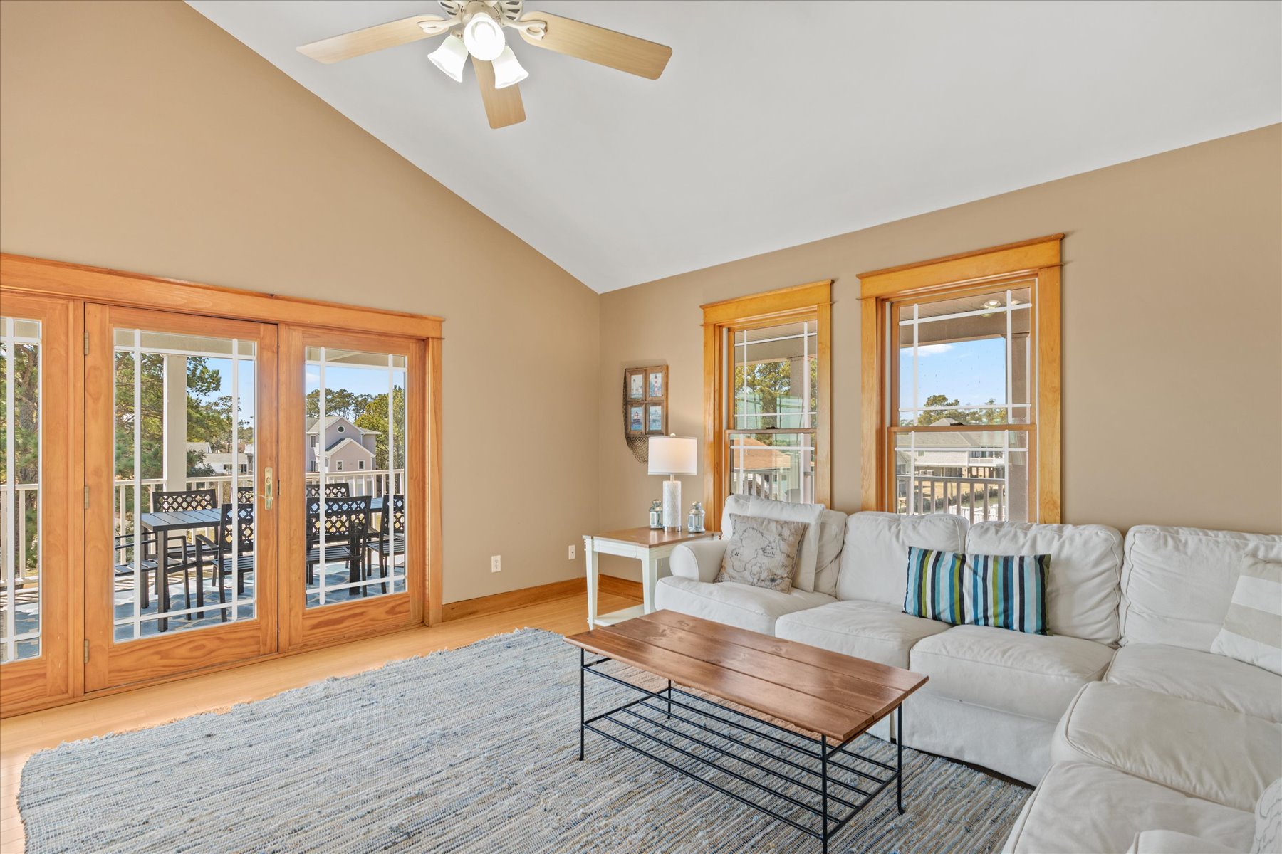 Soaring Ceilings and a wall of windows to the water.