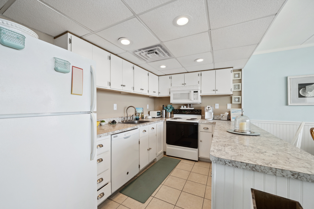 The spacious, fully equipped Kitchen is perfect for preparing delicious family meals.