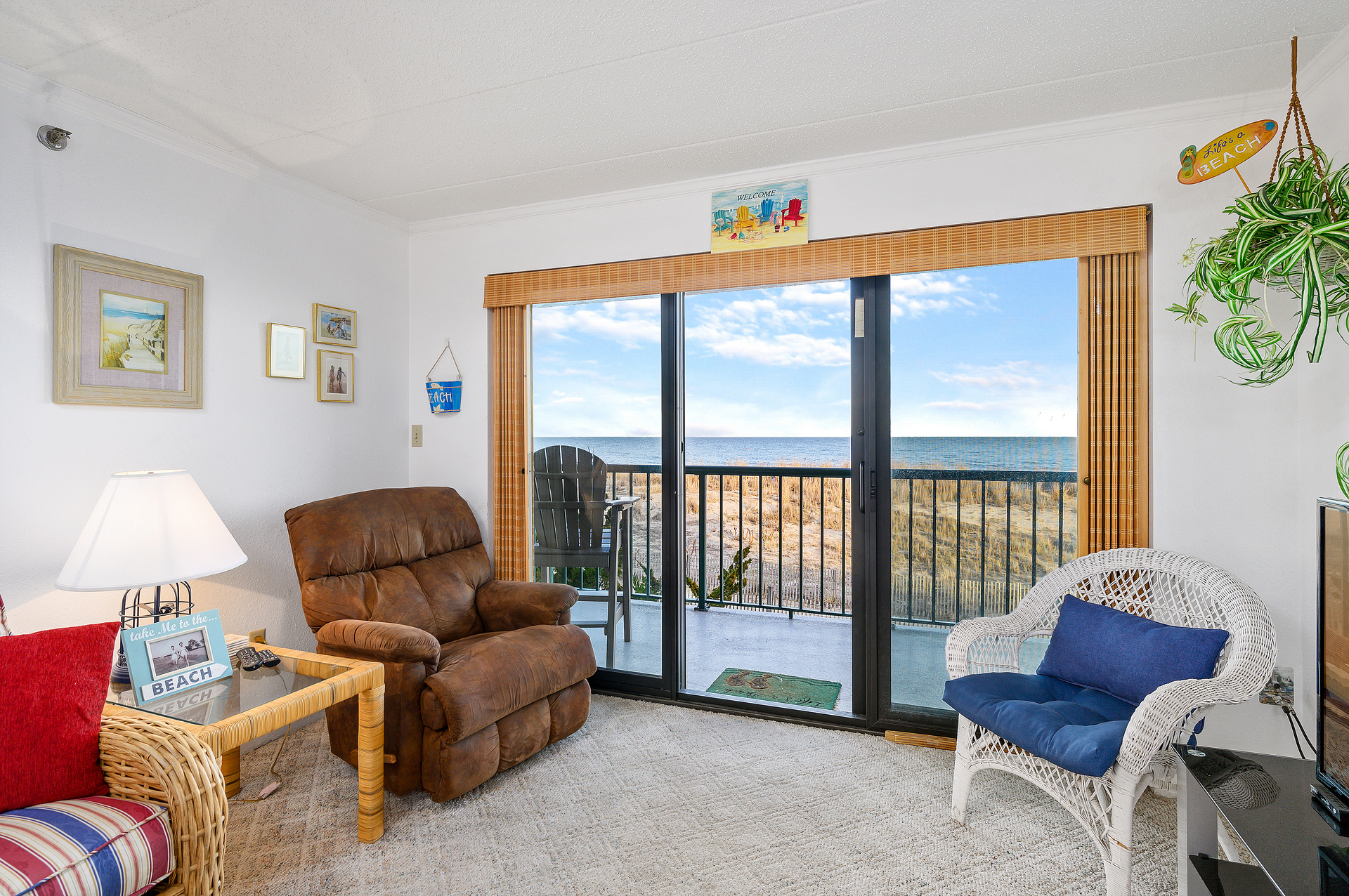 Enjoy the Sunrise from a comfy chair or glide outside to breathe in the Salty Air!