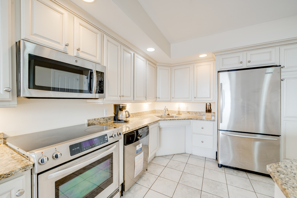 Stainless steel appliances and all your cooking supplies nearby for your convenience.