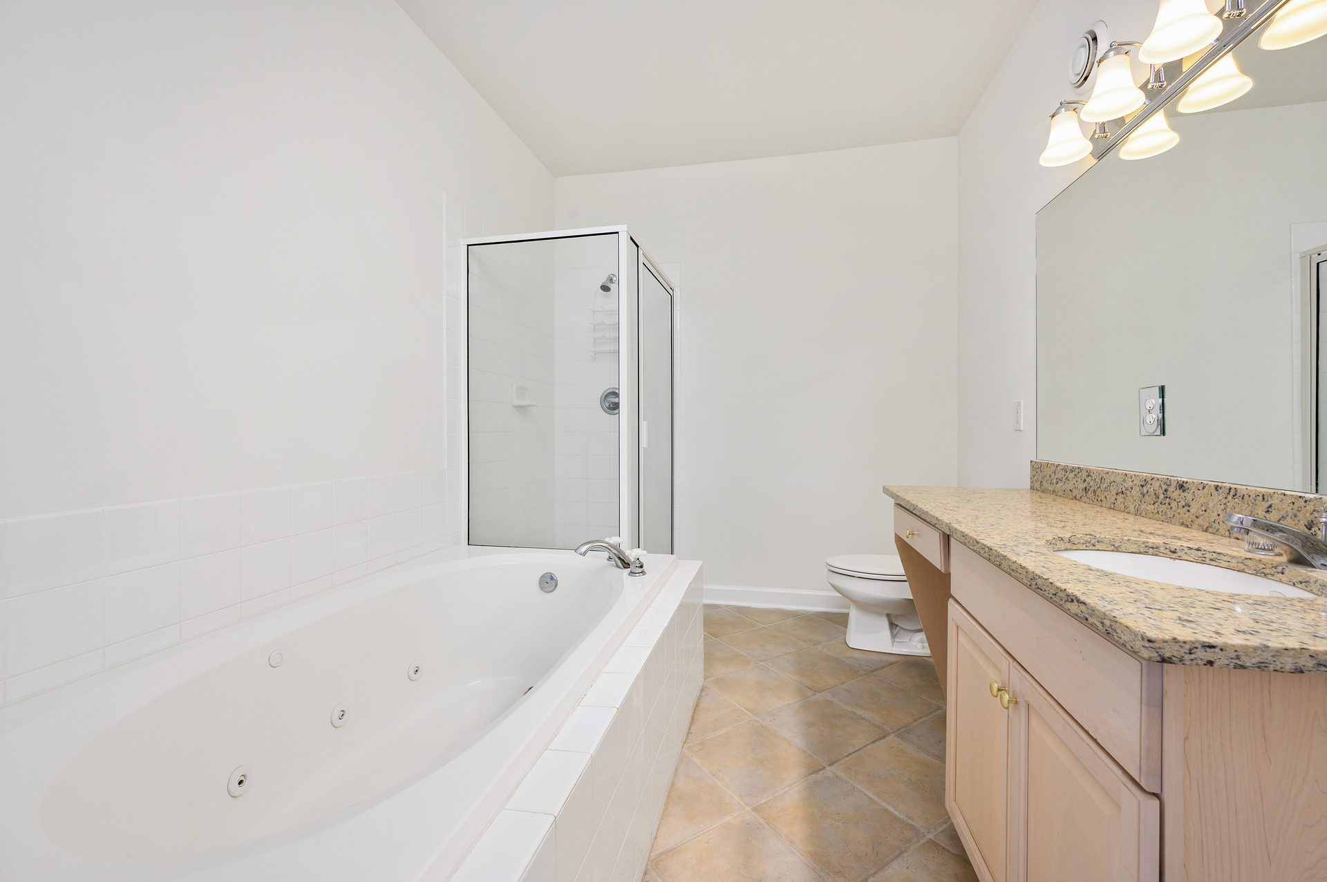 Relax and rejuvenate after a day at the beach in the large soaking tub or the glassed in shower