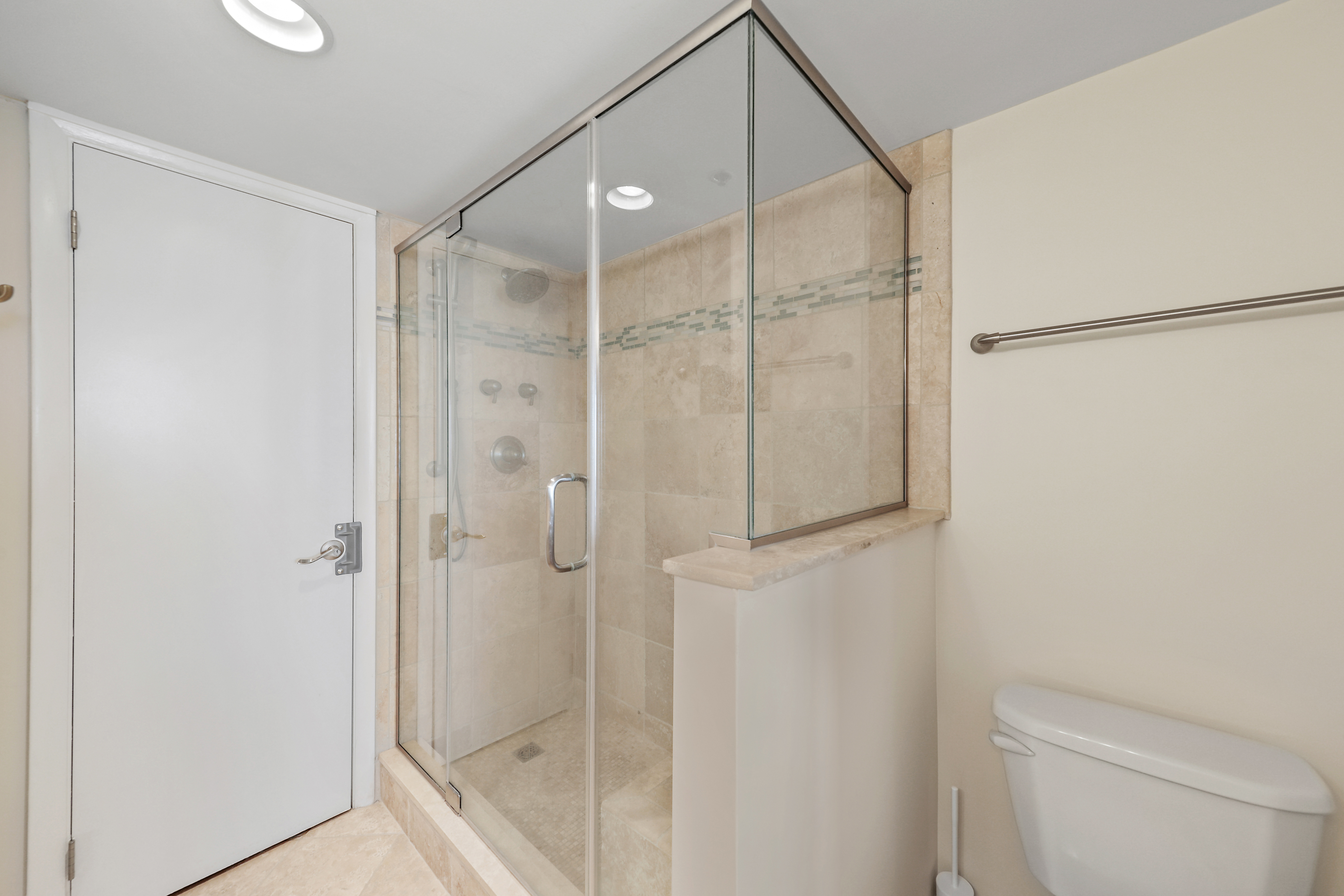 With a newly renovated custom tile shower!