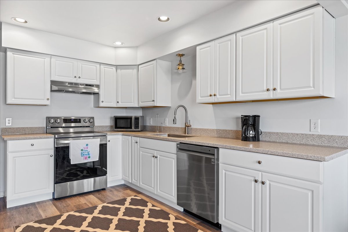 Brand New Kitchen has Stainless Appliances and Beachy White Cabinetry.