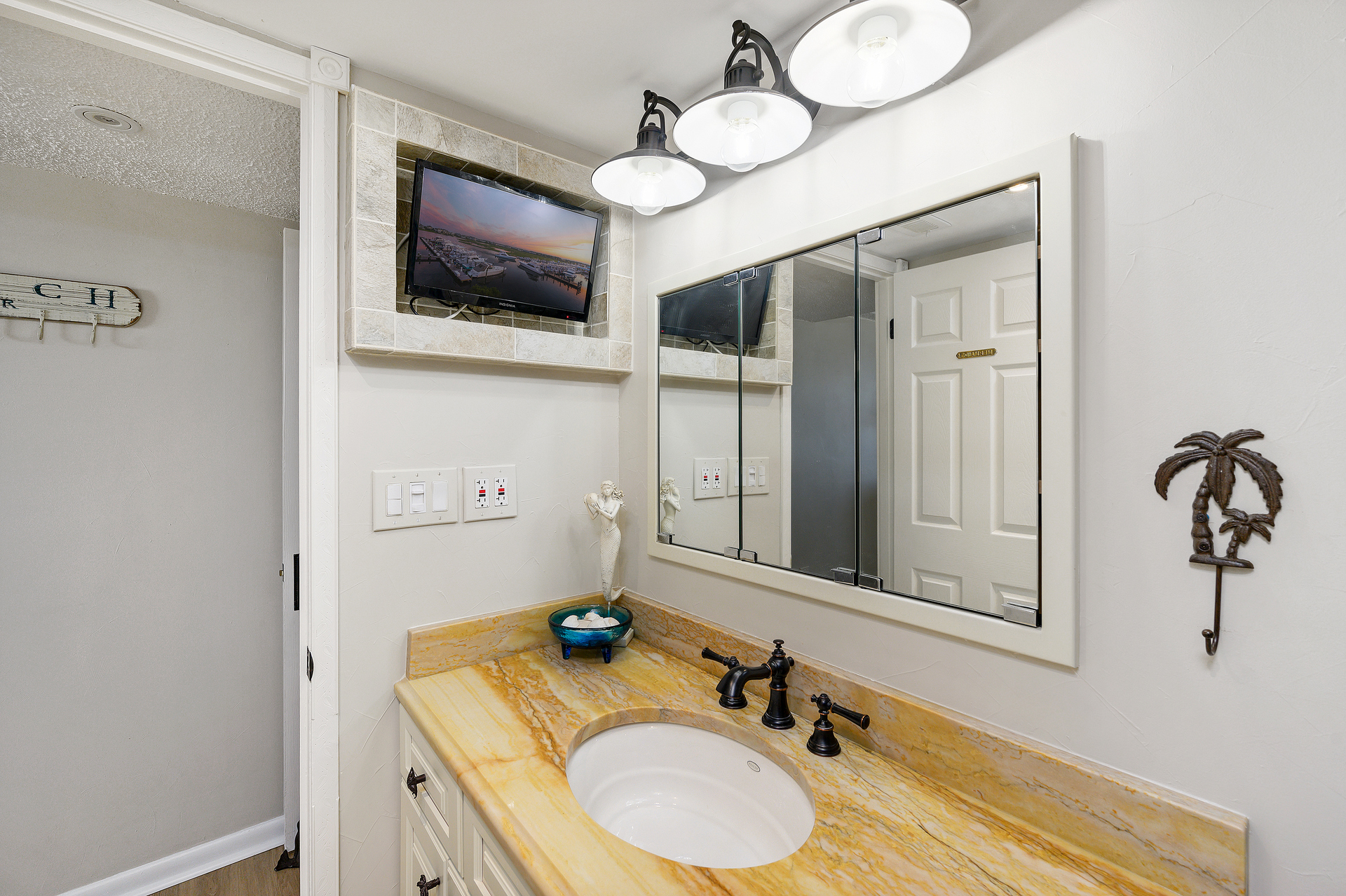 The Primary Bath has all you need to Relax and Unwind with even a TV to enjoy while you clean off after the day in the Shower/Tub combo