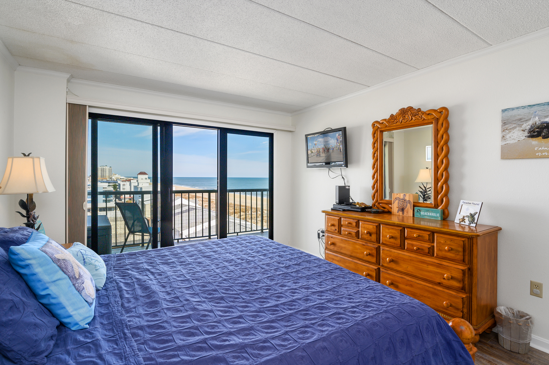 The Primary Bedroom is a quiet retreat with a King Bed and Balcony Access!
