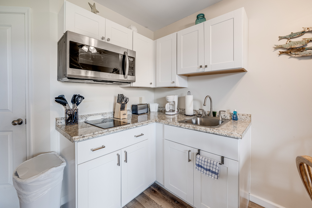 Microwave, 2 Burner Cooktop, Toaster Oven, and Coffee Maker.