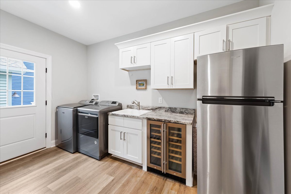 The Laundry Room offers a Full Washer & Dryer, Wine Fridge and addition Full Size Refrigerator!