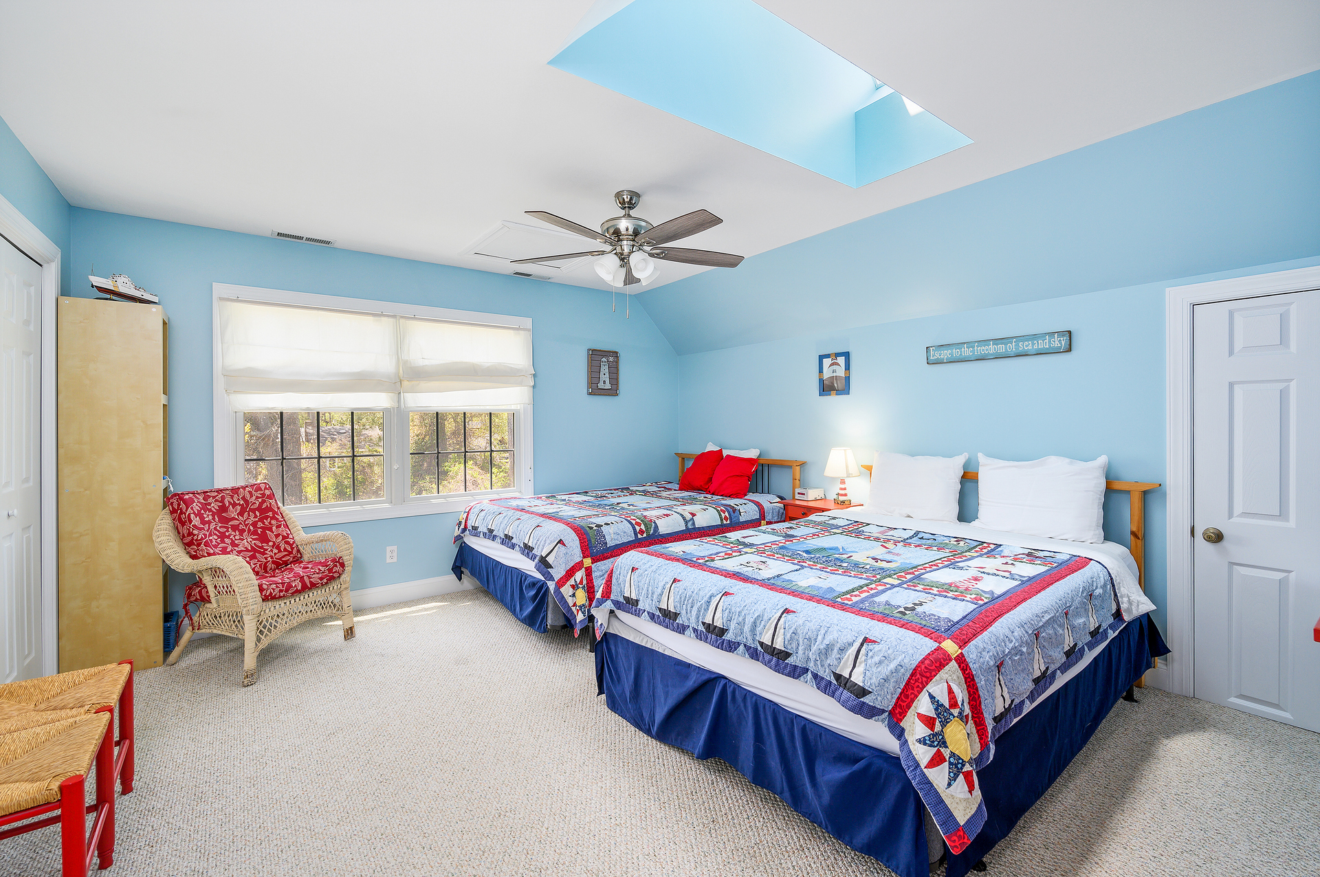 Upstairs, Bedroom 2 has 2 Queen Beds, a TV, and lots of space.