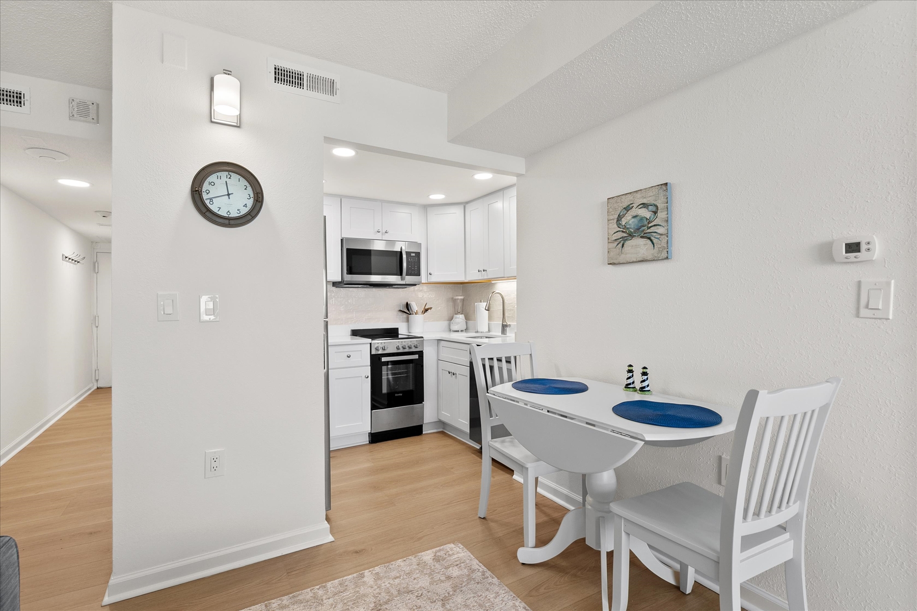 Grab a quick breakfast or enjoy a cozy dinner at the intimate dining table set for two.