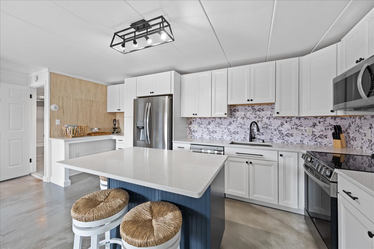 The Gleaming Quartz Countertops are a Chef's Dream.