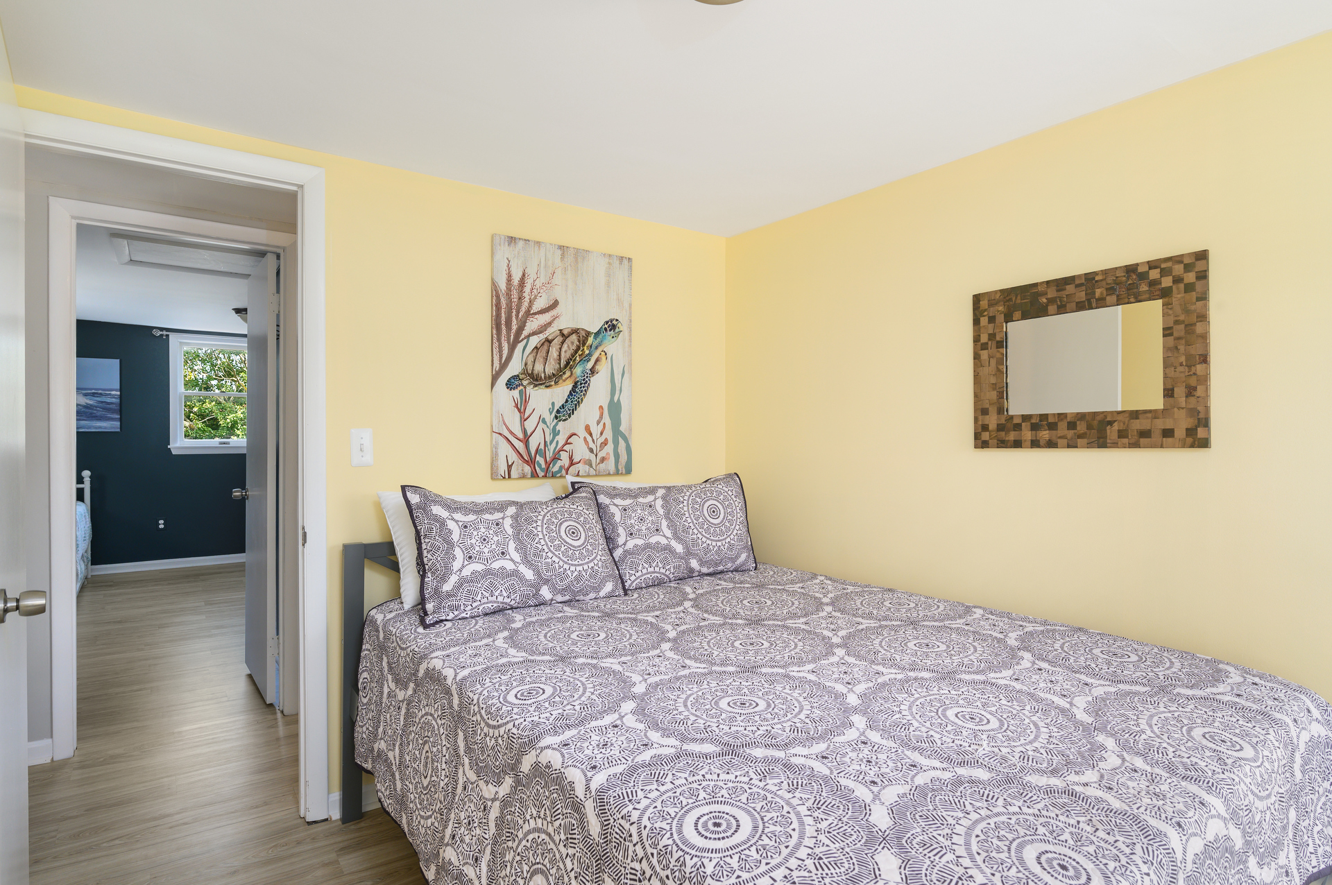 Bedroom 1 is bright and sunny with a Queen Bed.