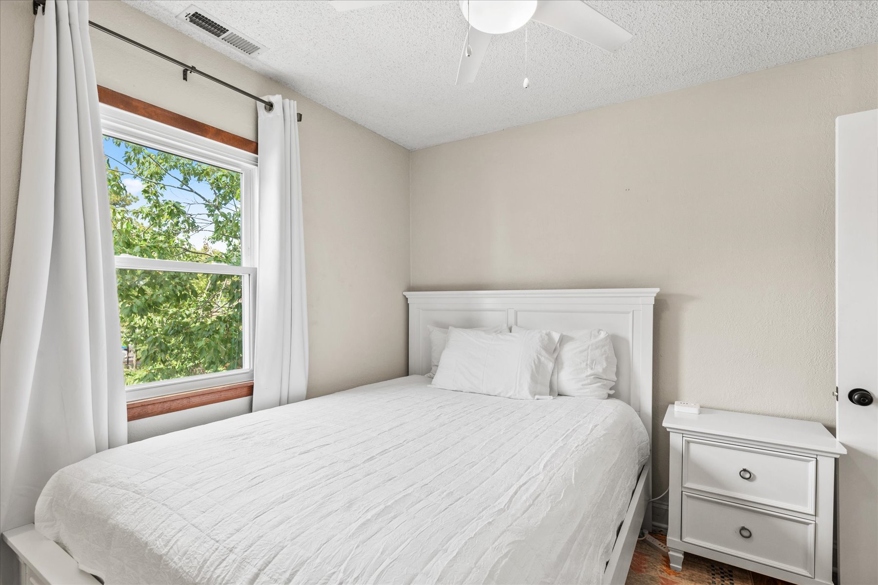 Sink into the Queen Bed after a fun day in the Sun.