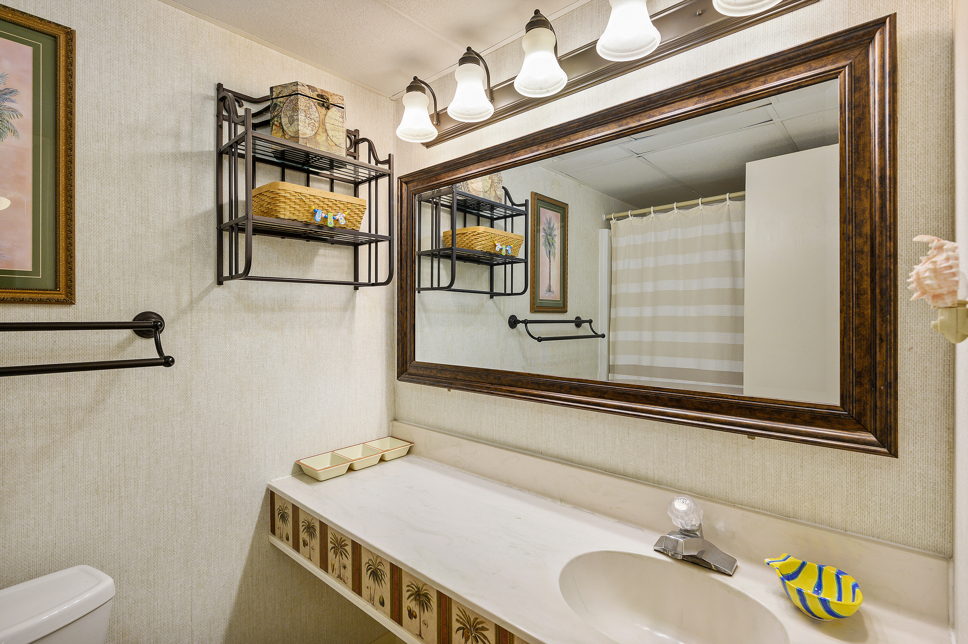 Bathroom 2 is found down the hall from Bedroom 2.