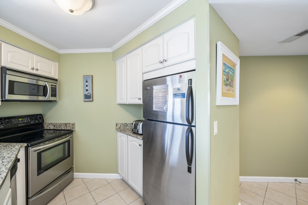 Gleaming white cabinetry and Stainless-Steel appliances throughout!