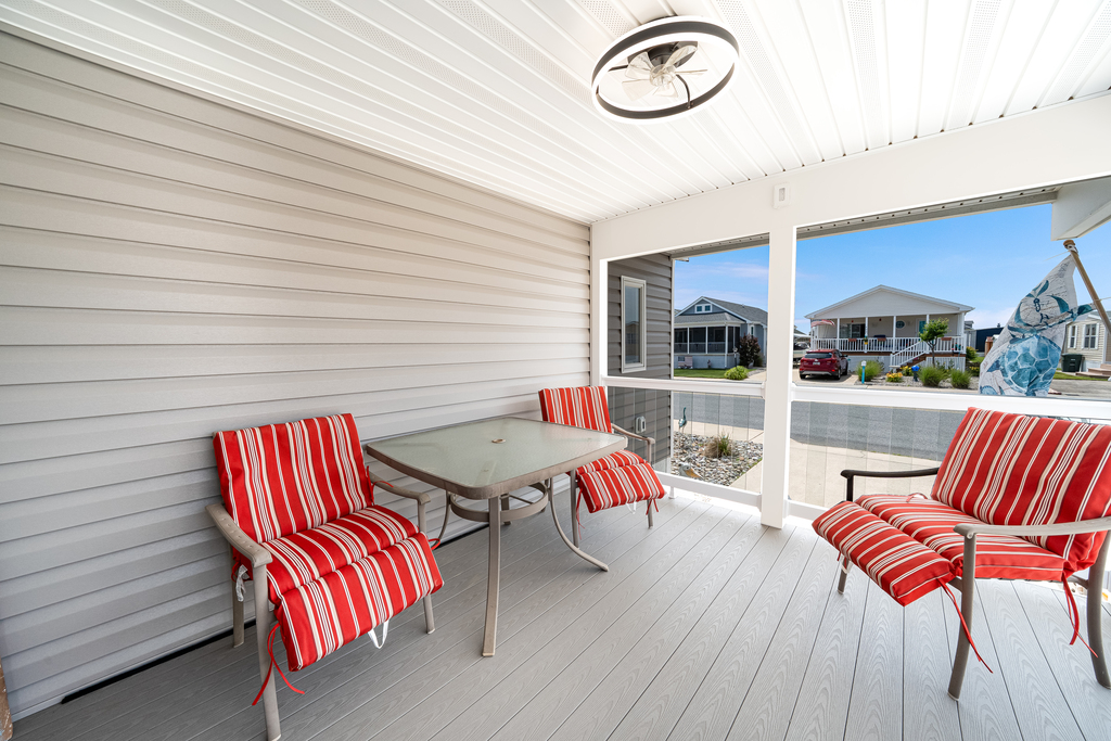 Screened porch with plenty of seating.