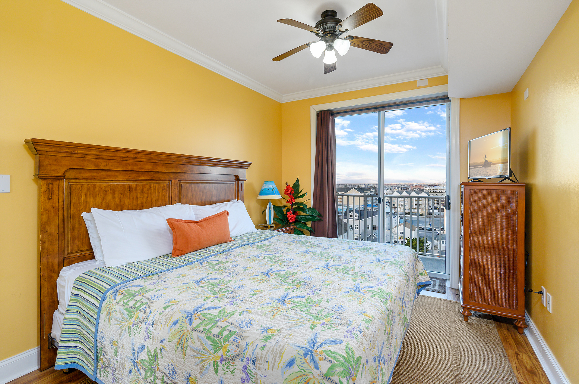 Bedroom 2 is a wonderful Jr Primary with King Bed, Balcony and Bathroom access