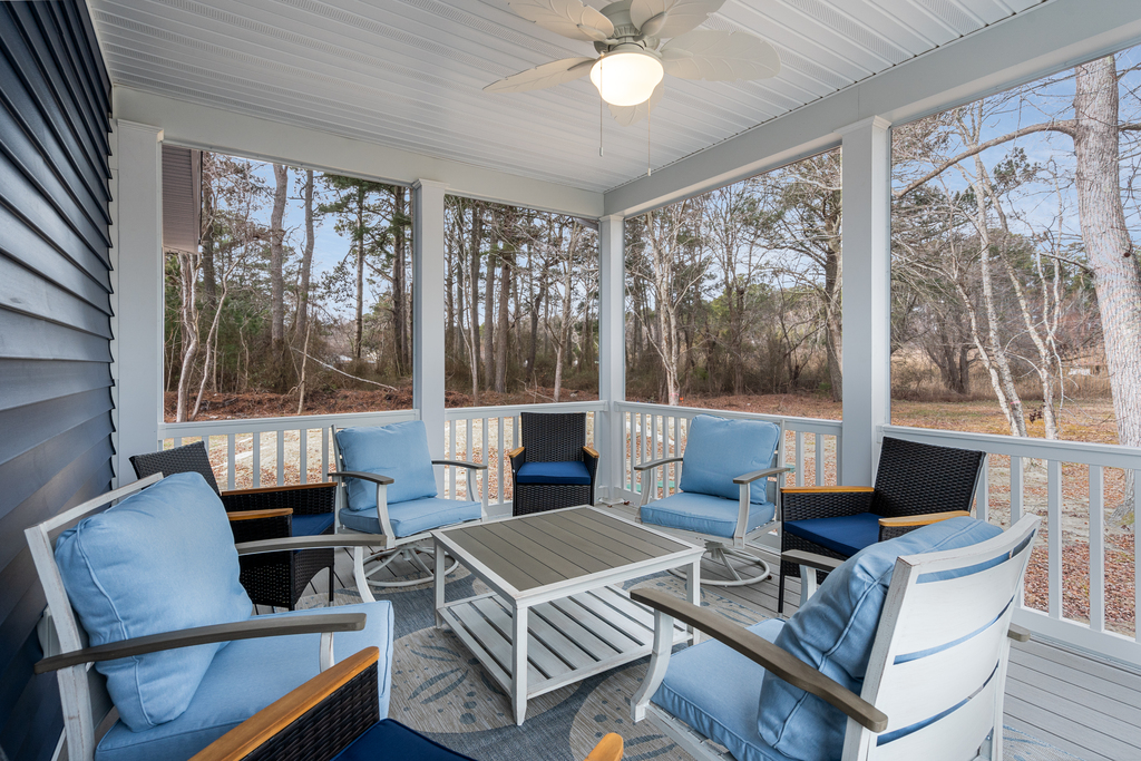 Screened In Porch with plenty of seating for the entire family