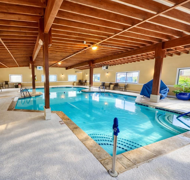 Rainy days won't spoil the fun thanks to this spacious and bright indoor pool amenity.
