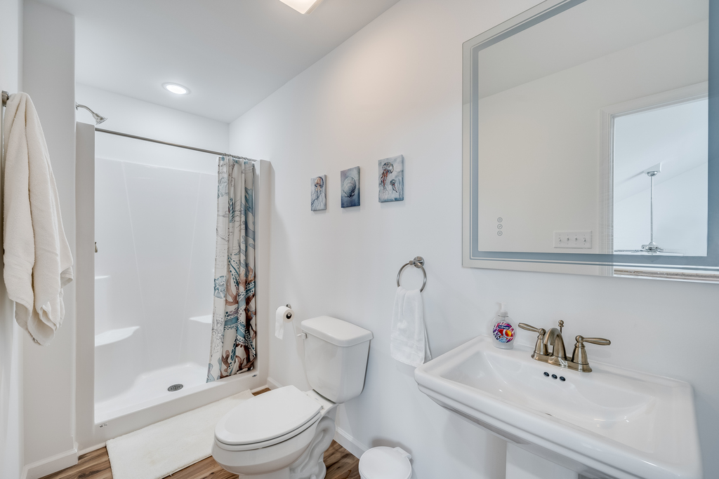 A 3rd Full Bath with Walk-in Shower is also upstairs.