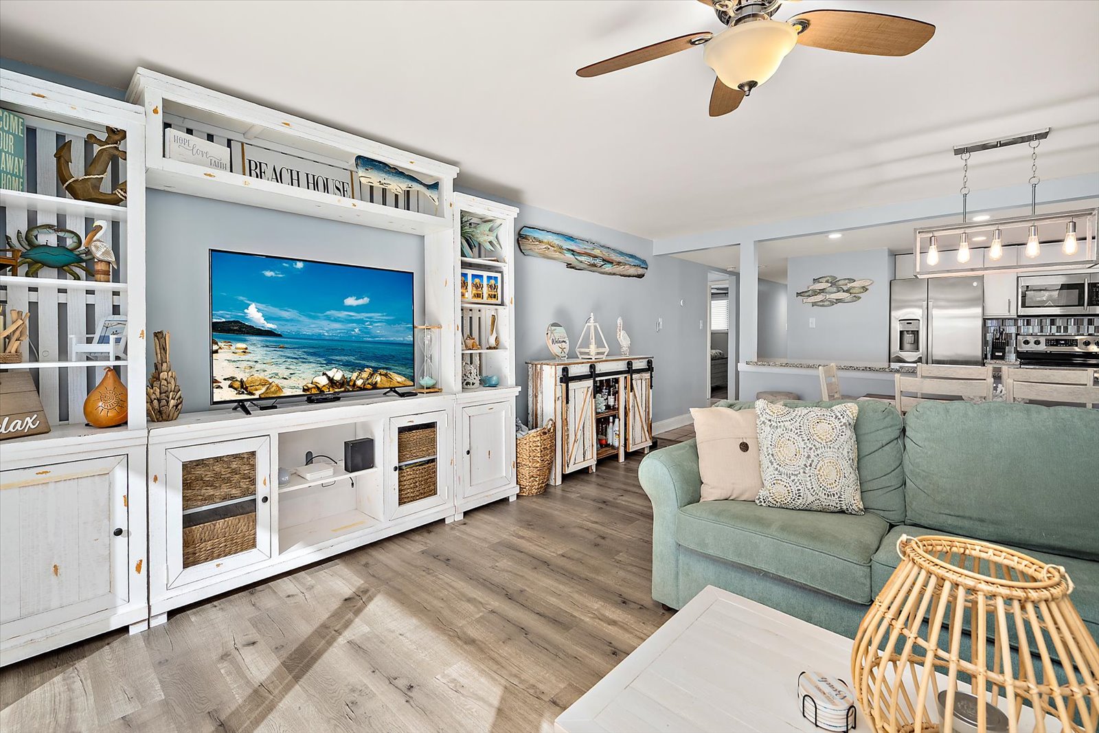 Modern coastal interior featuring a large flat-screen TV and inviting open layout.