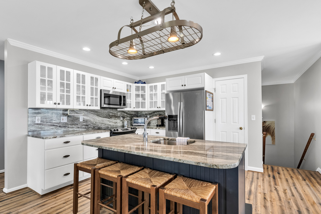 Gorgeous Kitchen has Gleaming Granite and Stainless Steel Appliances.