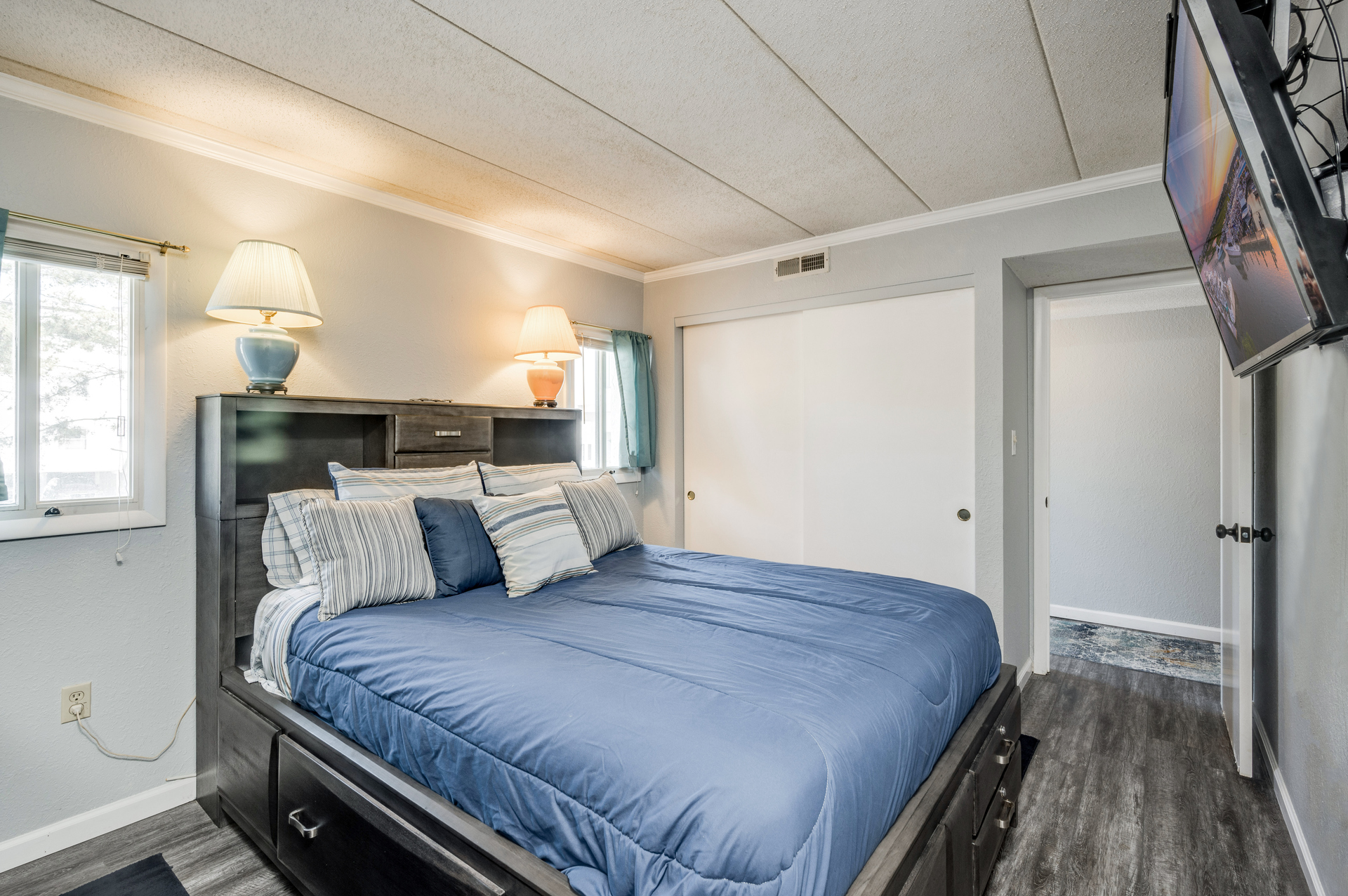 Primary bedroom is located at far end of the home, private and away from living areas