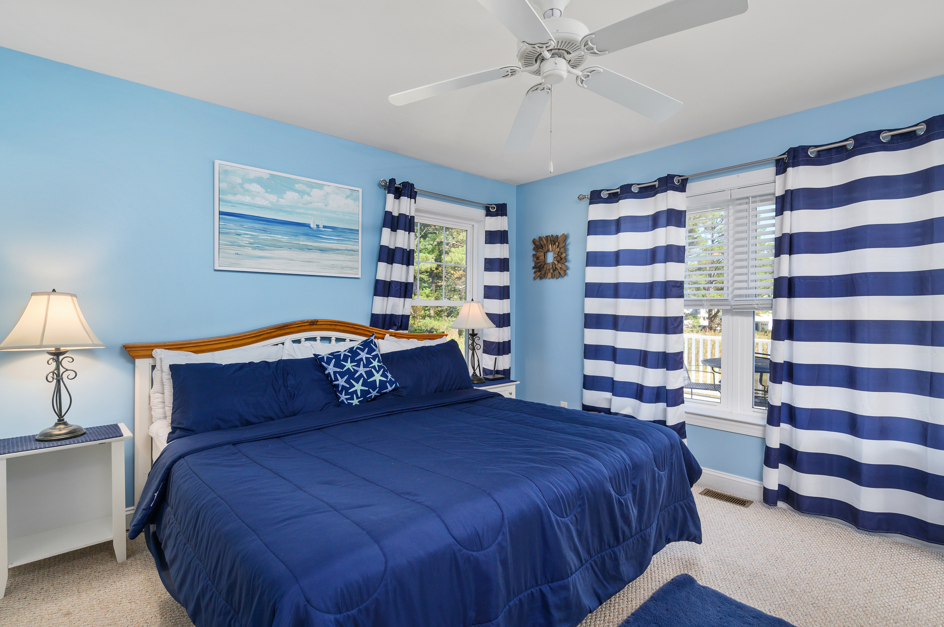 Adorned in Nautical Navy and Crisp White in the 1st Floor Master Bedroom.