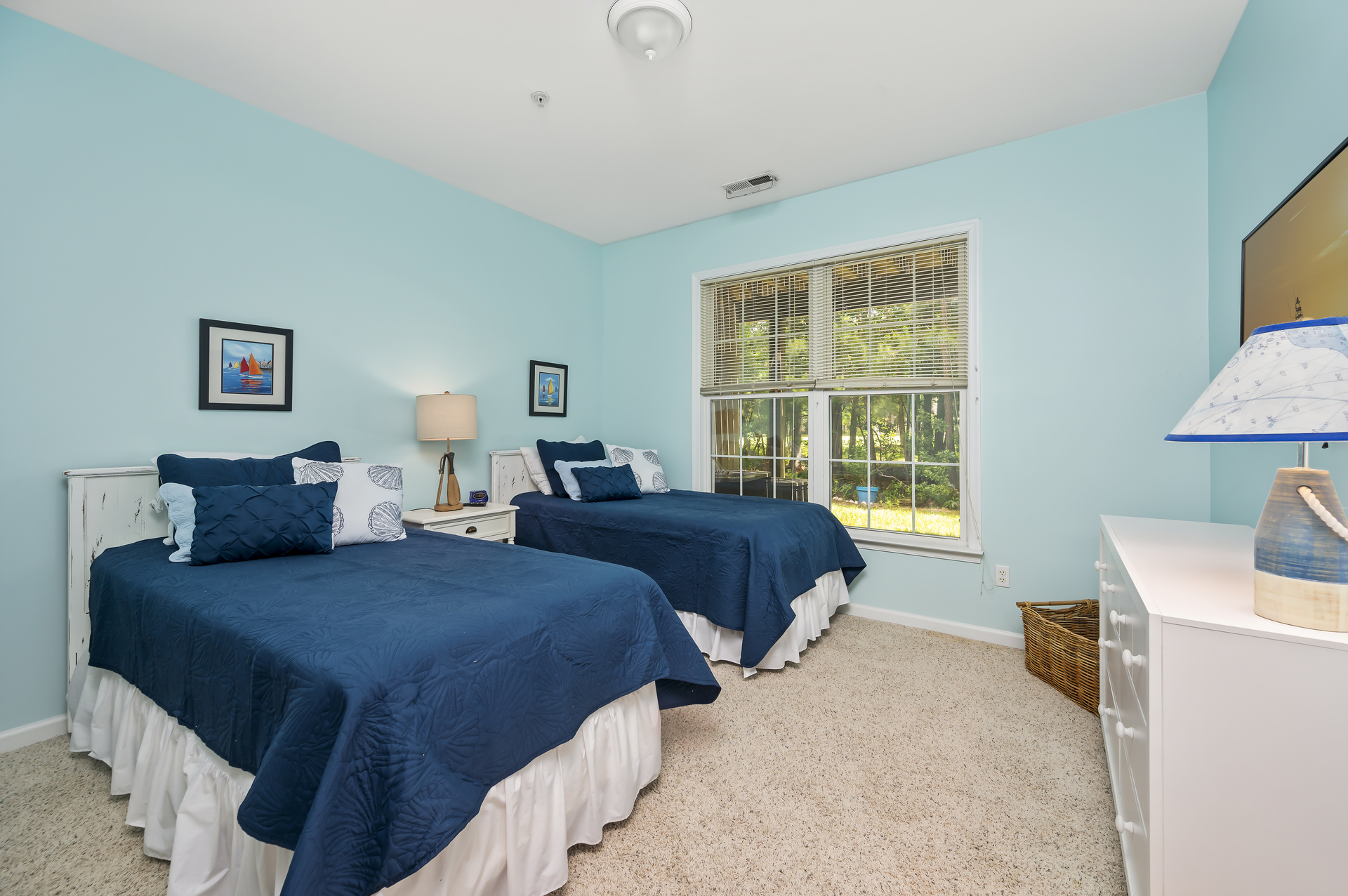 Bedroom 3 on the lower level has 2 twin beds and a smart TV