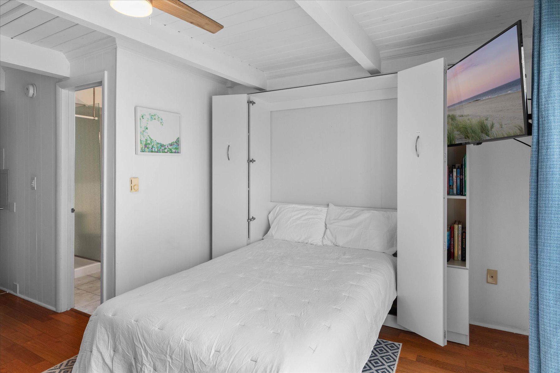 The Murphy bed lifts right back up to create more room!