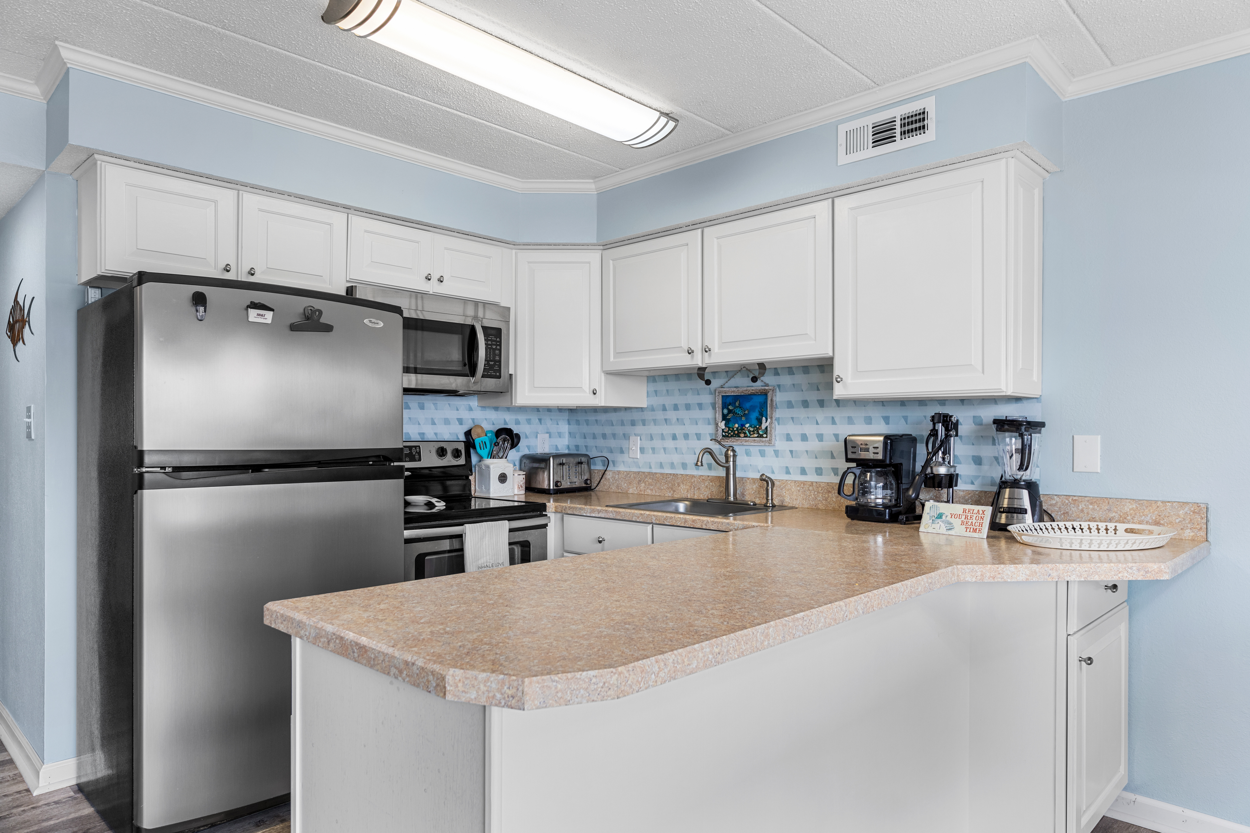 The kitchen overlooks the living and dining area