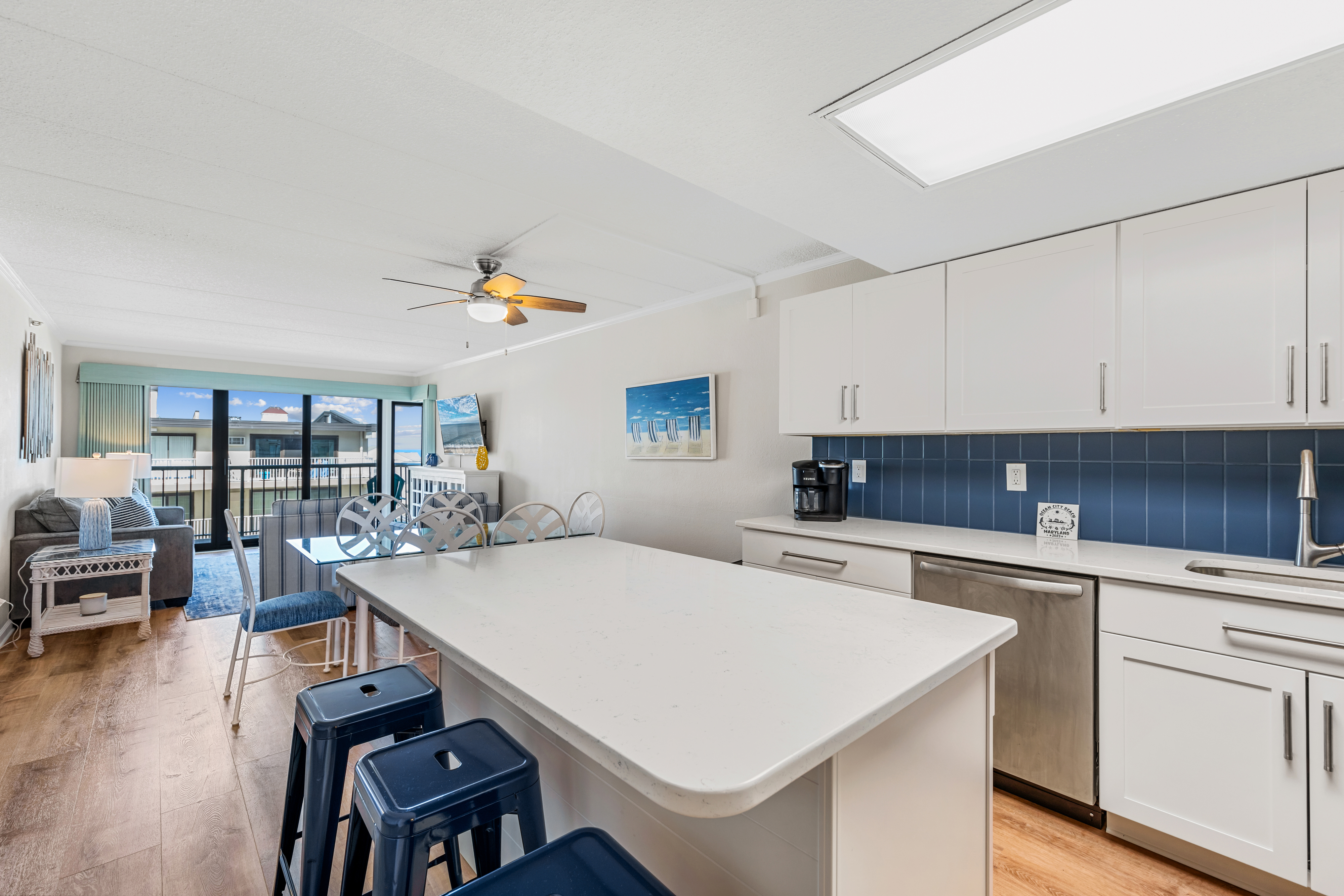 Gleaming White Cabinetry Welcomes you to this Stunning Kitchen!