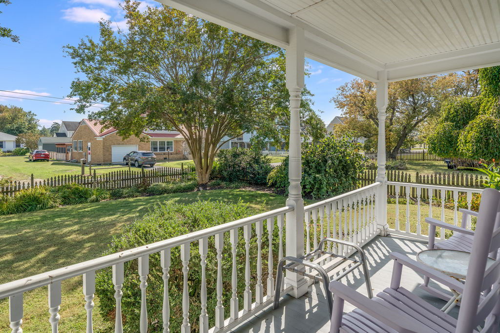 Sit on the Covered Front Porch and sip sweet tea while watching our Island come to life each morning.