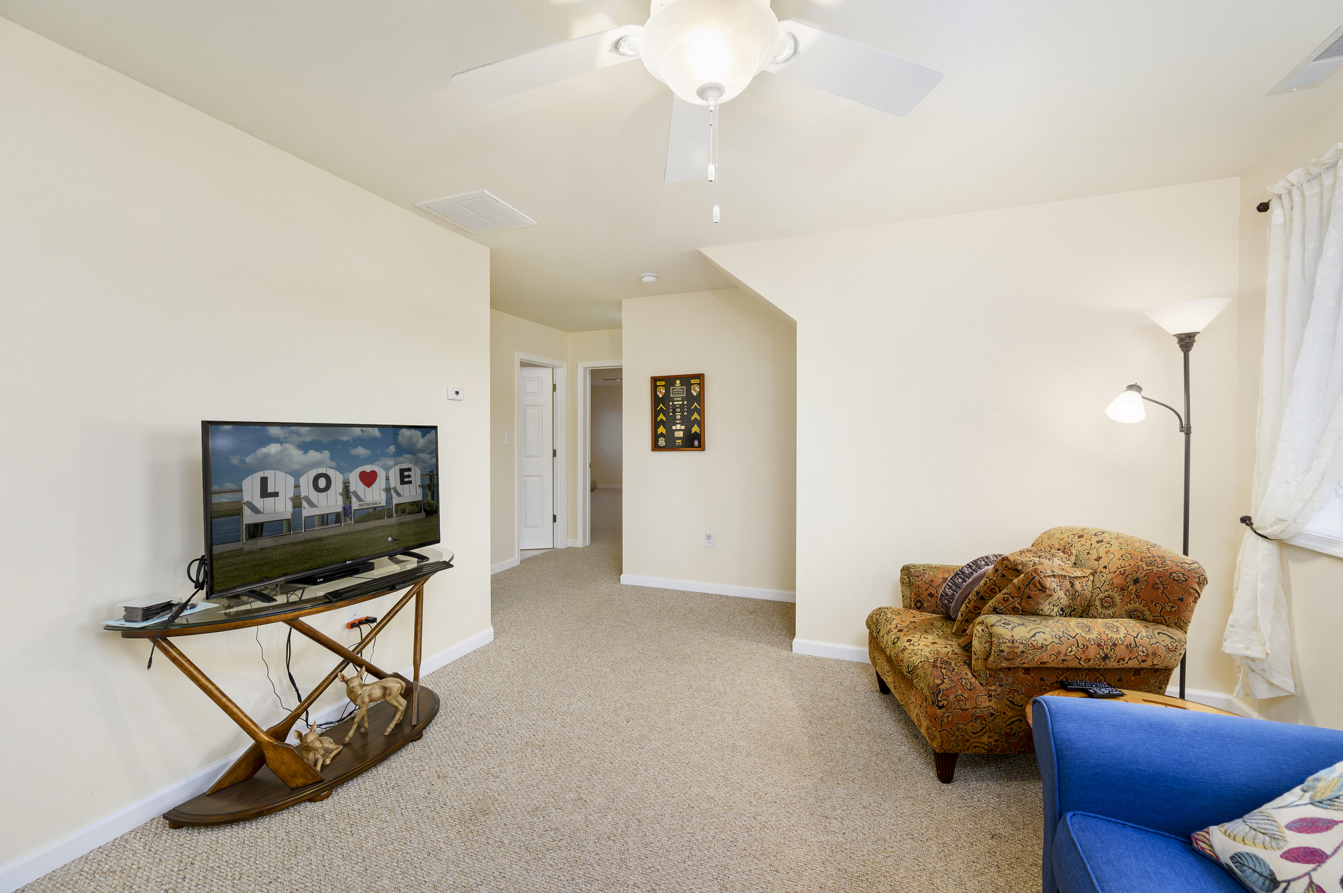 Wandering upstairs, you'll find a Family Room with Flat Screen TV.
