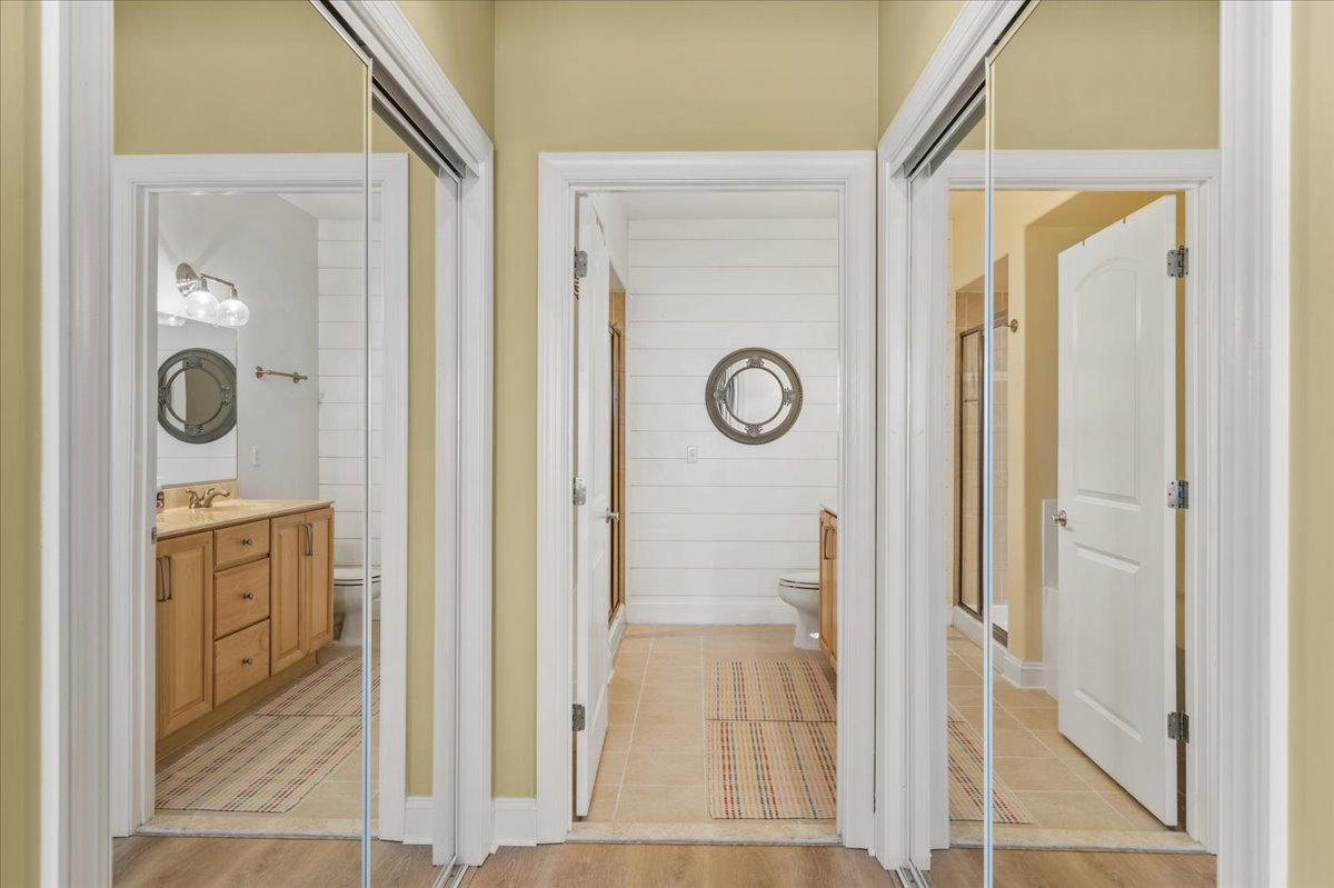 Two Spacious Closets on each side - looking towards Private Attached Full Bath.