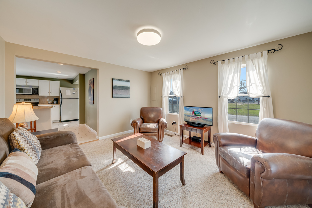 Relax in the Living Area with Free WiFi, comfy furnishings, and Flat Screen Smart TV.