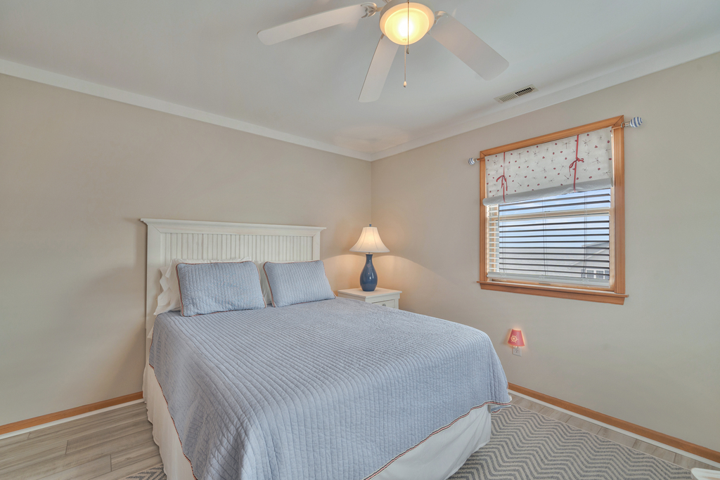 Bedroom 3 has serene colors and a Queen Bed.