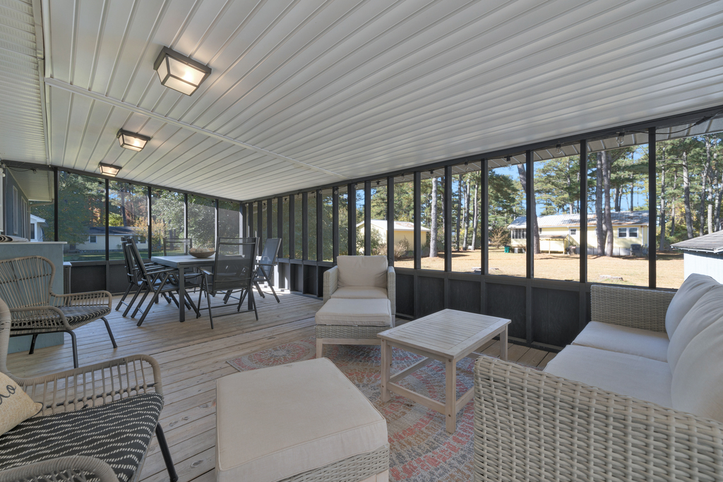 Dine Al Fresco in the newly expanded Screened-in Porch