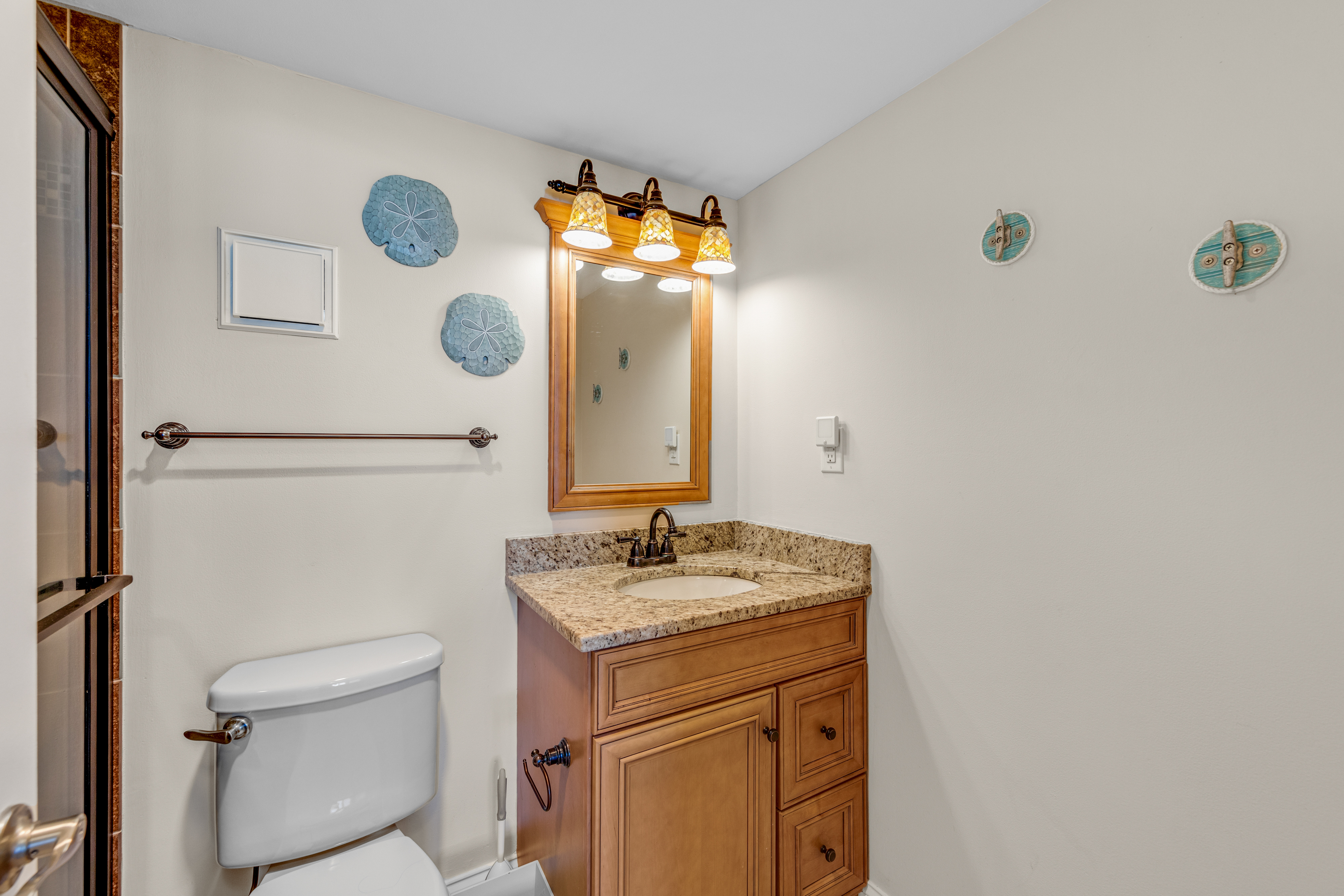 Private Primary Bath with Gleaming Granite Vanity.