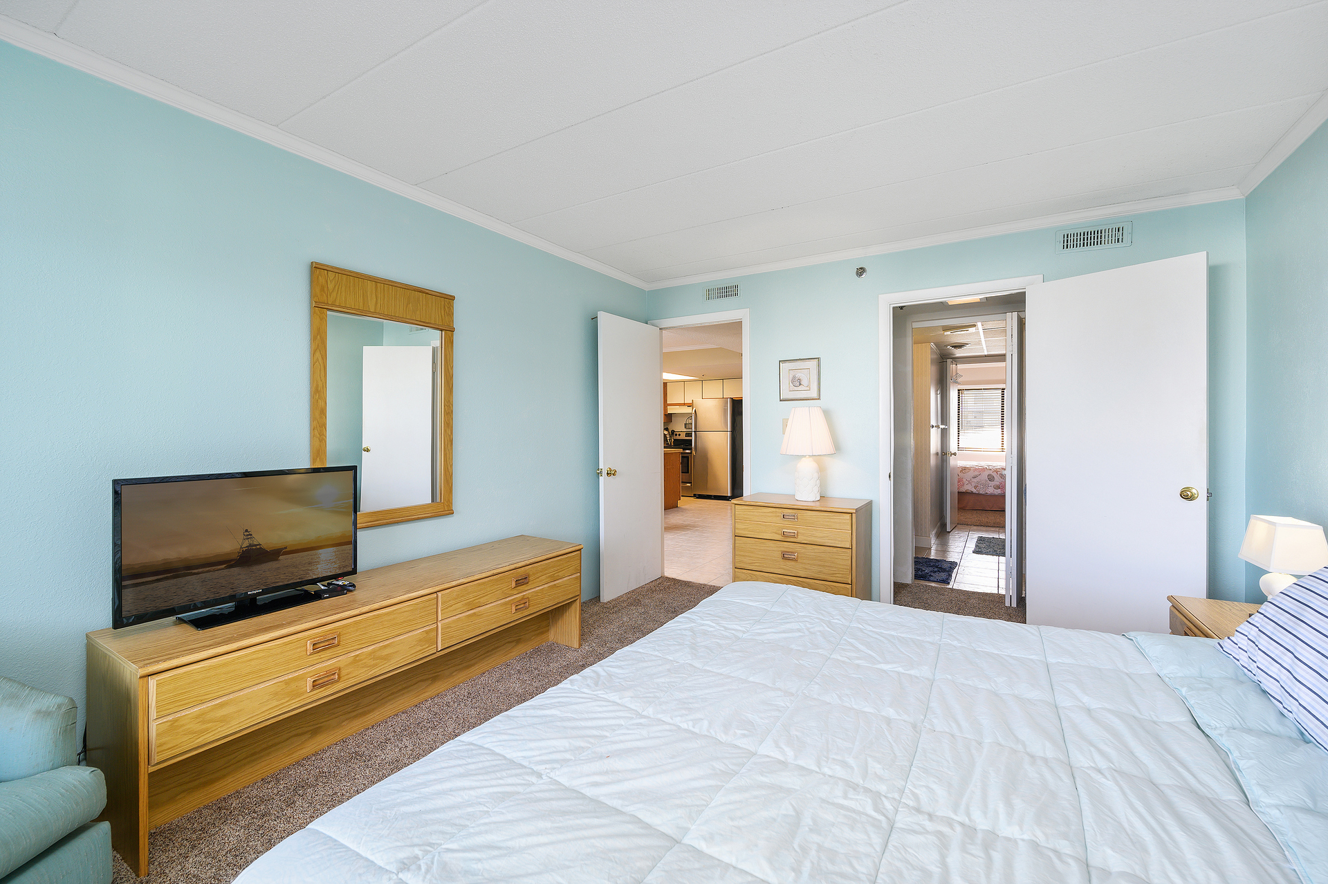 Relax and watch a movie or slip out onto the balcony from the Primary Bedroom