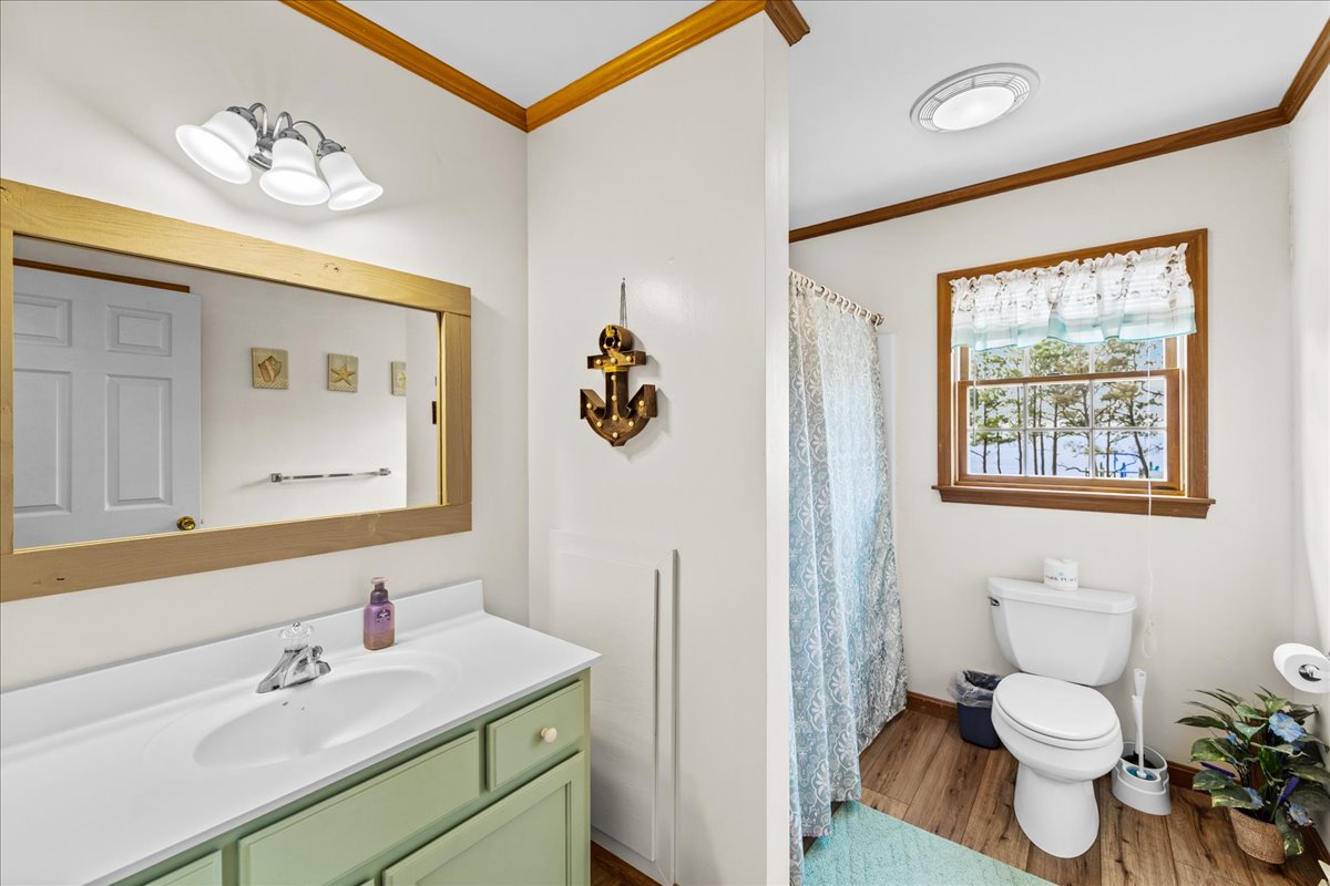Full Bath 2 has a Beachy Vanity and Tub/Shower Combo.