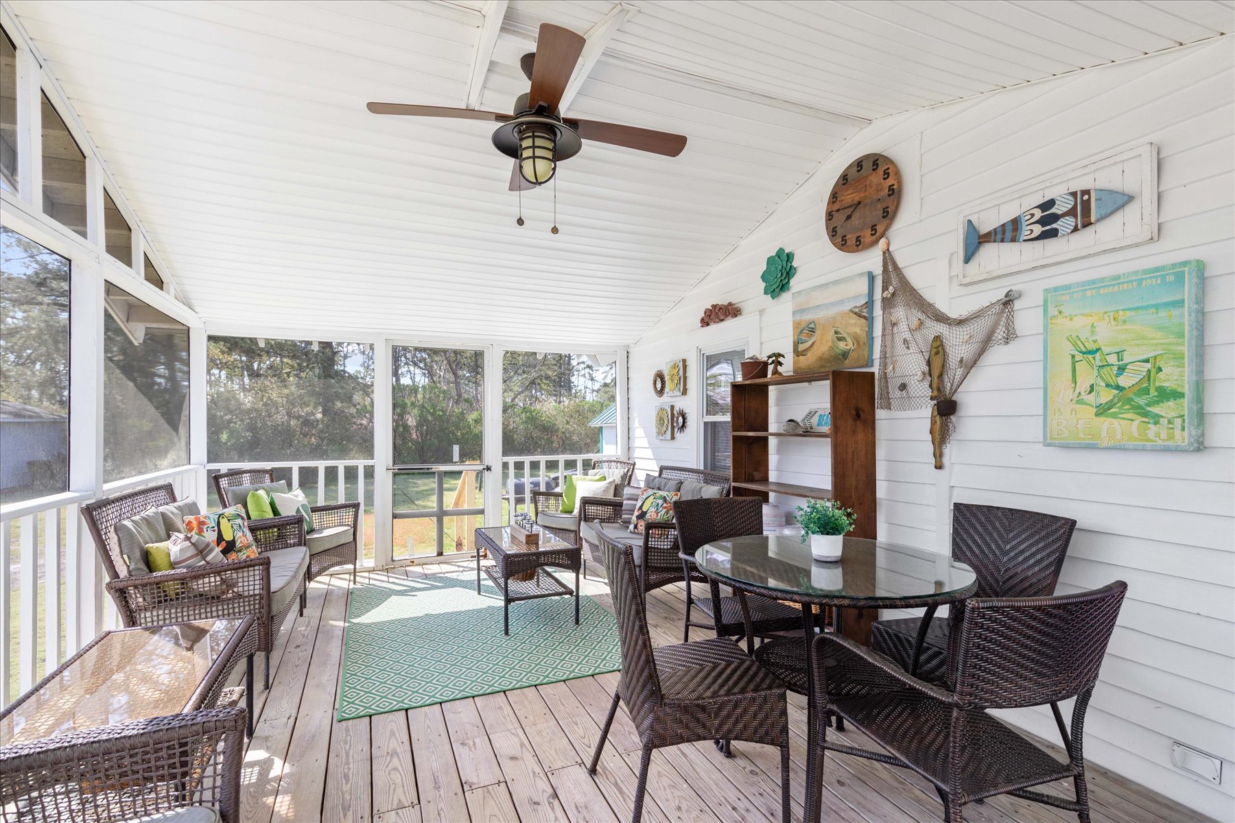 Screened Porch has Dining Set and lots of comfy seating.