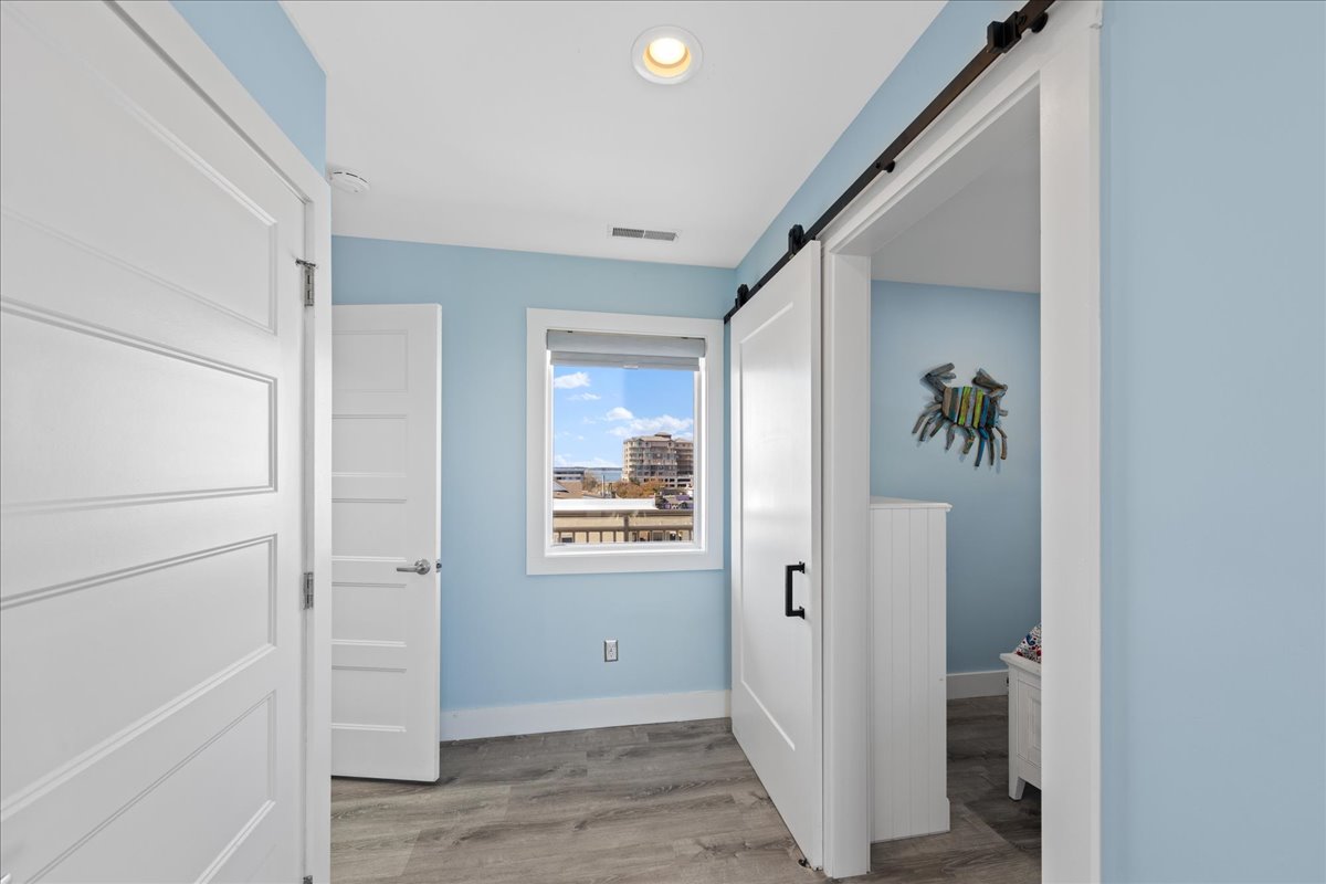 Stylish Barn Doors Welcome You into the 3rd Bedroom.