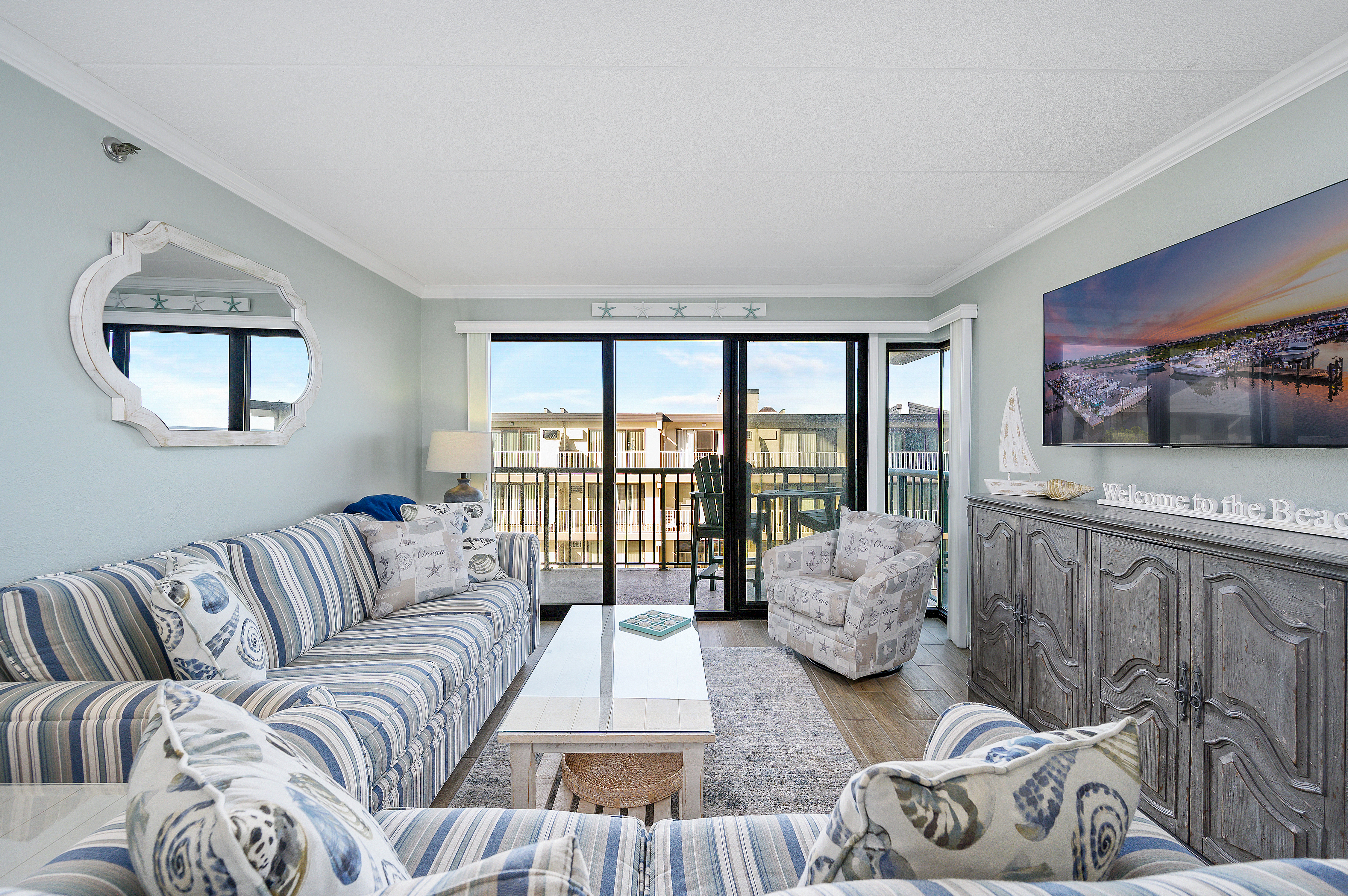 As you wander past the kitchen, the living room will invite you right in to relax after a day of fun in the sun at the beach