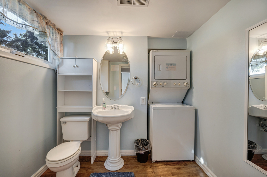 On the Lower Level, there is a Half Bath and Stacked Washer and Dryer.